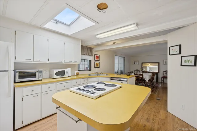 a kitchen with a table chairs and a stove