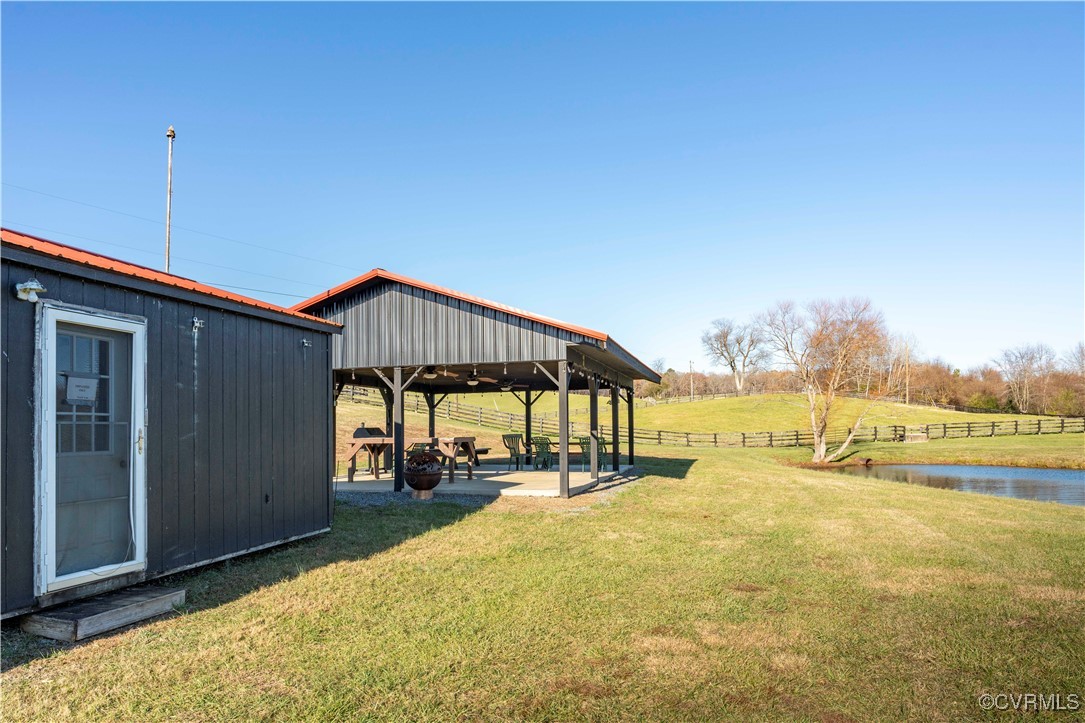 2427 South Blue Ridge Turnpike Rochelle, VA 22738 - Photo 16 of 50 View of yard with an outbuilding, a water view, an