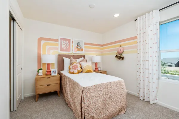 a bedroom with a bed and a table