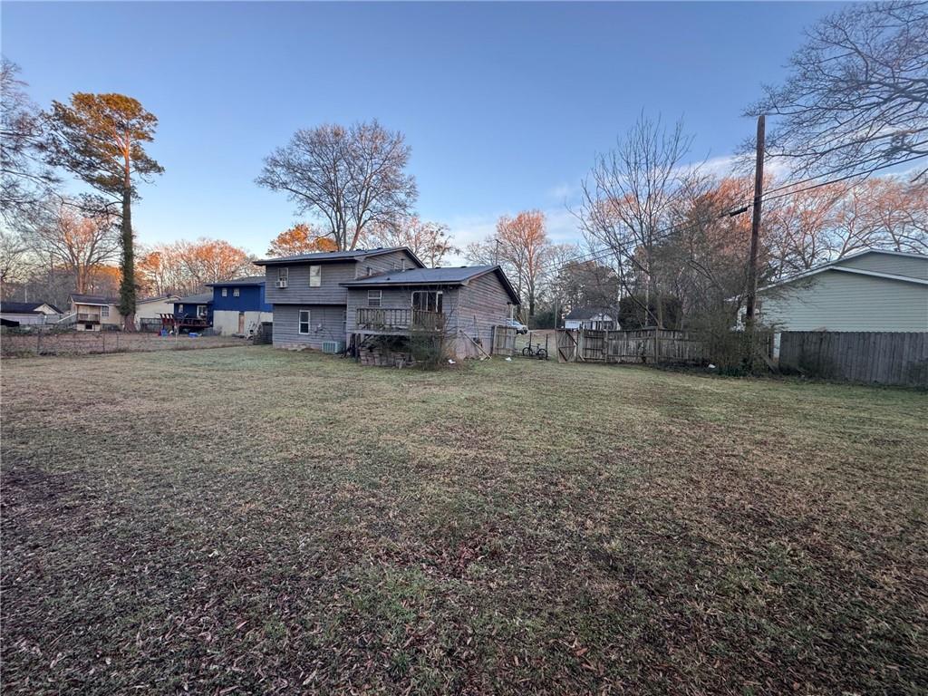 55 Porter Circle Hampton, GA 30228 - Photo 2 of 6 a view of a house with a yard and tree s