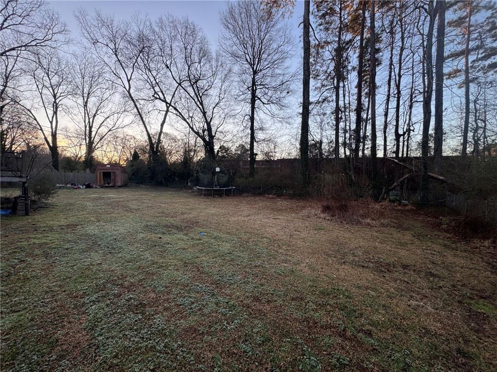 55 Porter Circle Hampton, GA 30228 - Photo 4 of 6 a view of a yard with trees