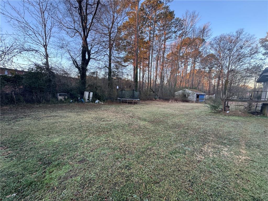 55 Porter Circle Hampton, GA 30228 - Photo 5 of 6 a view of a yard with a tree
