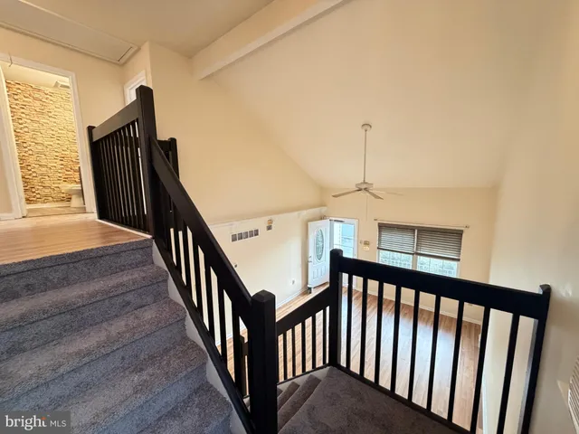 a view of a hallway with stairs
