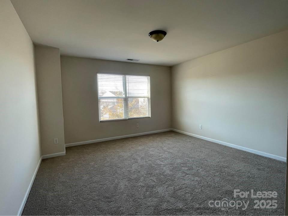 8715 Balsam Bay Road Charlotte, NC 28227 - Photo 11 of 15 an empty room with windows