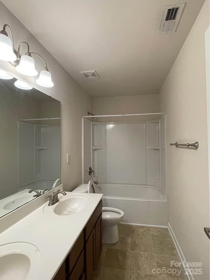 8715 Balsam Bay Road Charlotte, NC 28227 - Photo 12 of 15 a bathroom with a sink a toilet and shower