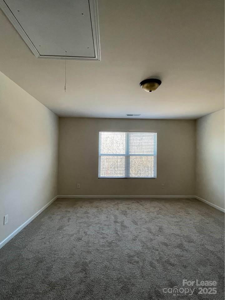 8715 Balsam Bay Road Charlotte, NC 28227 - Photo 8 of 15 an empty room with a empty space and windows