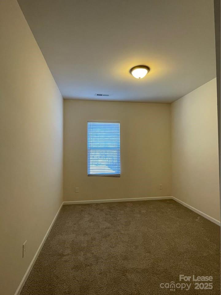8715 Balsam Bay Road Charlotte, NC 28227 - Photo 9 of 15 an empty room with a empty space and a window