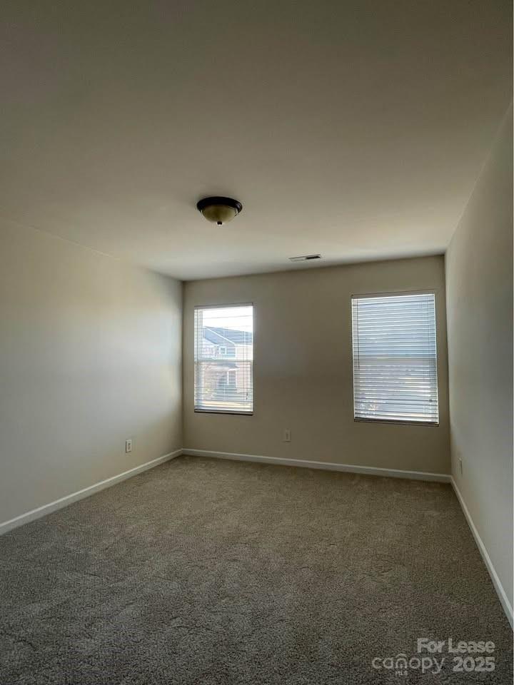 8715 Balsam Bay Road Charlotte, NC 28227 - Photo 10 of 15 an empty room with a window