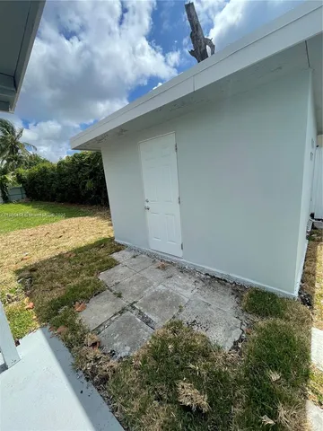 a view of a backyard of the house