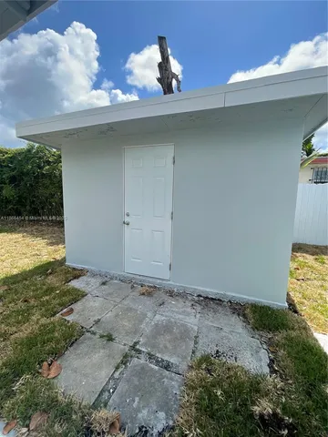 a view of a room with a wooden fence