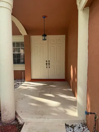 a view of empty room with windows