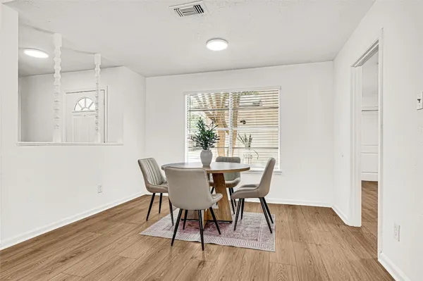 a bedroom with a bed and a potted plant