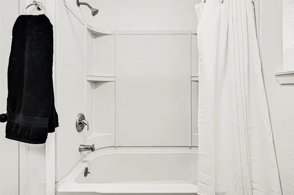 a view of a house with a yard and garage