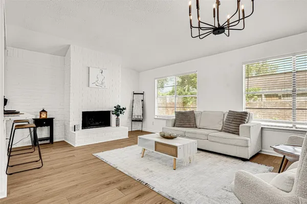 a kitchen with stainless steel appliances a sink and a refrigerator