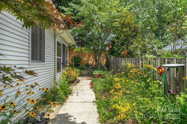 a backyard of a house with lots of green space