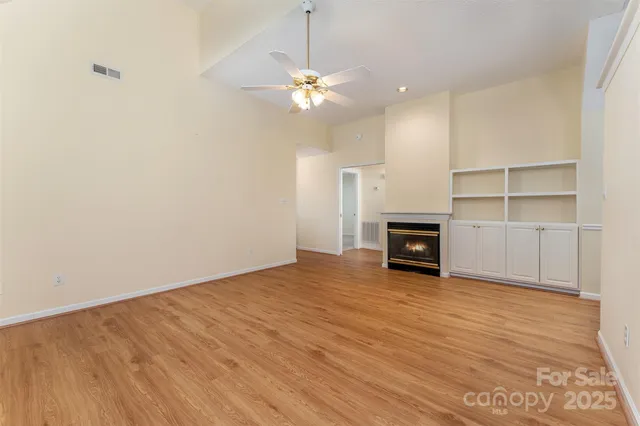a view of a room with cabinet and a fireplace