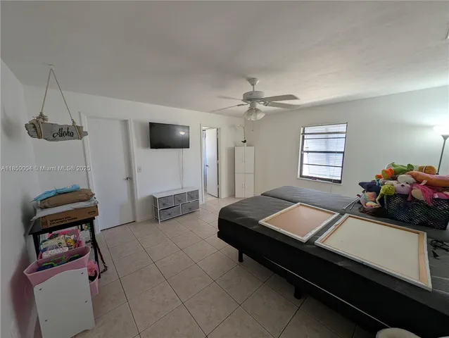 a room with furniture and a flat screen tv