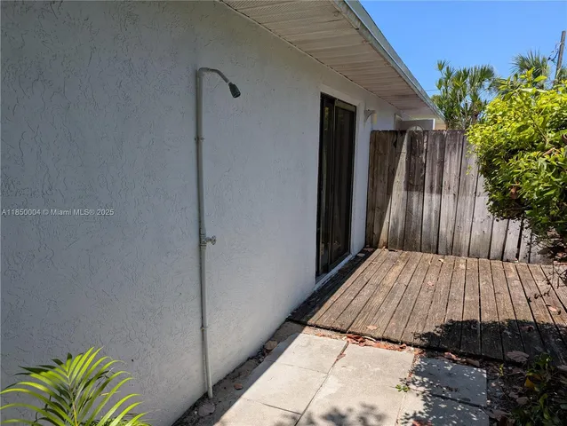 a view of backyard with a deck