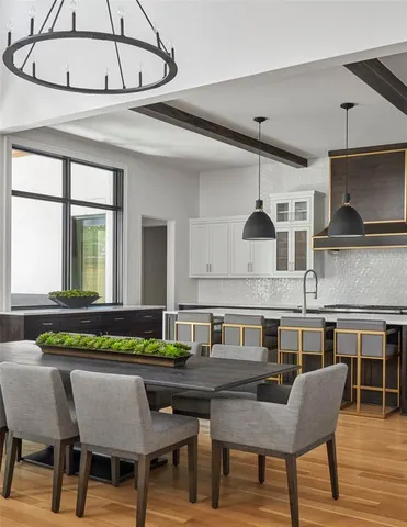 a kitchen with a table and chairs in it