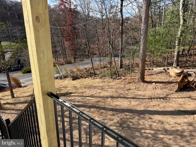 a view of a backyard of the house