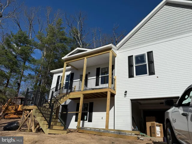a view of a house with a street