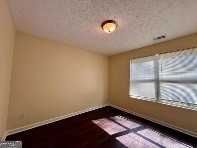 a bathroom with a tub and shower