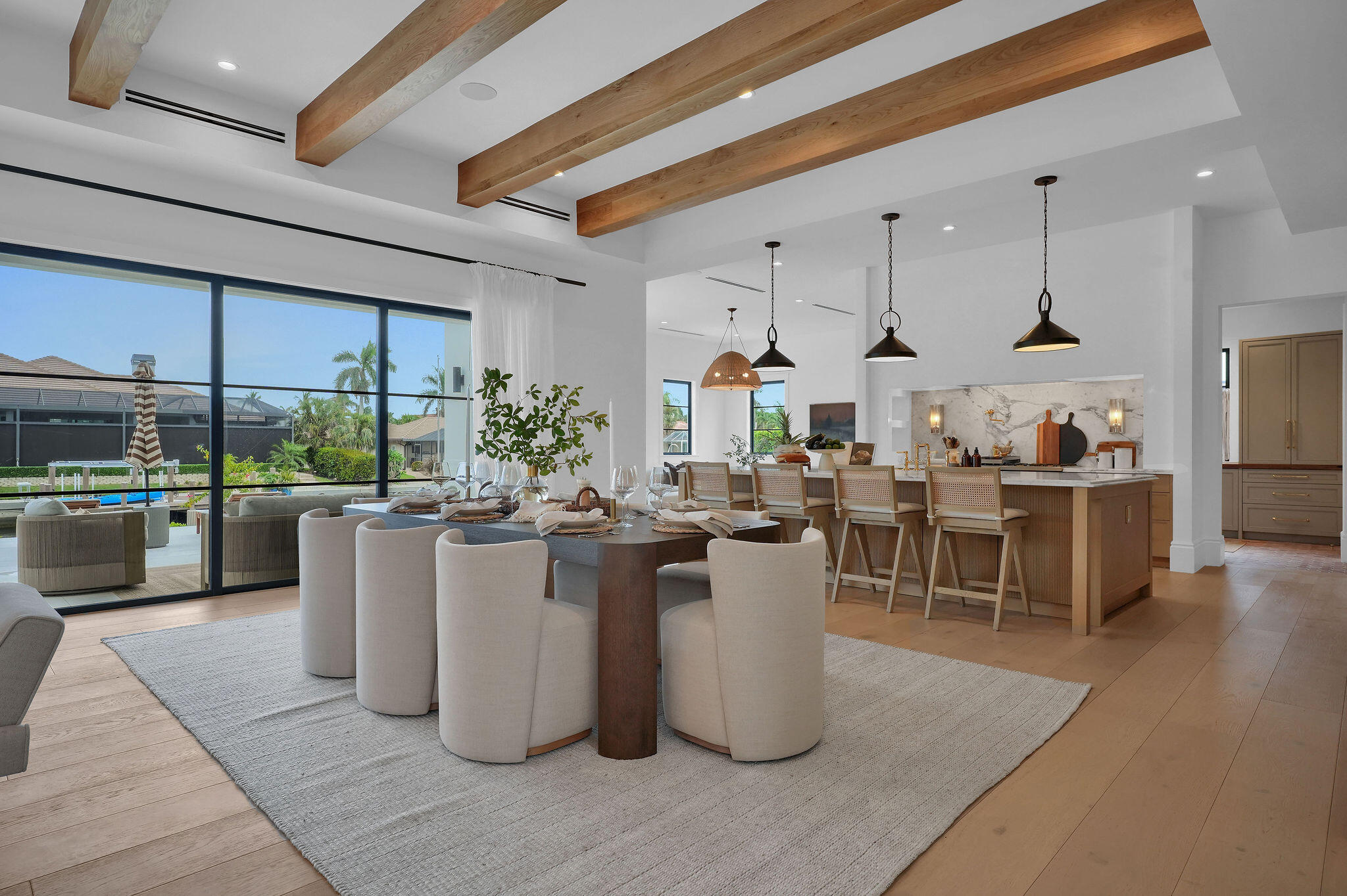 839 Chestnut Court Marco Island, FL 34145 - Photo 32 of 88 Dining table beneath white oak beams