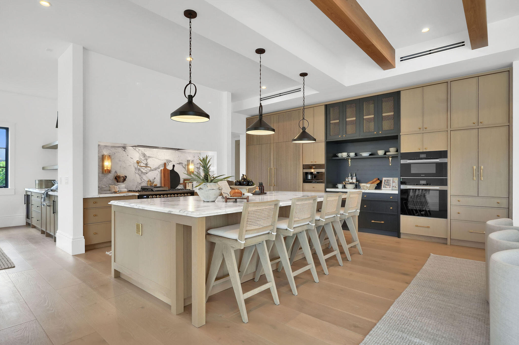 839 Chestnut Court Marco Island, FL 34145 - Photo 41 of 88 a kitchen with stainless steel appliances kitchen island granite countertop a table chairs sink and cabinets