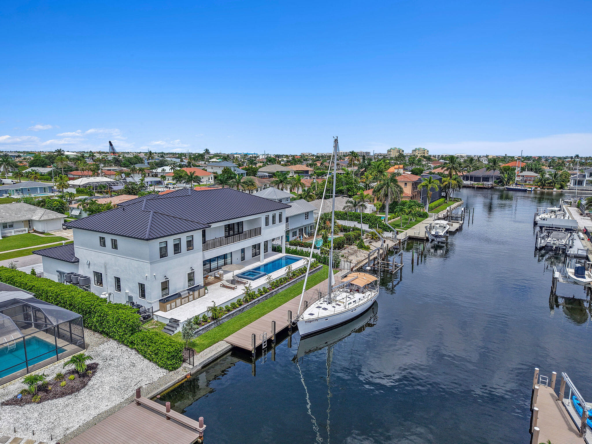 839 Chestnut Court Marco Island, FL 34145 - Photo 60 of 88 an aerial view of a house with a garden and lake view