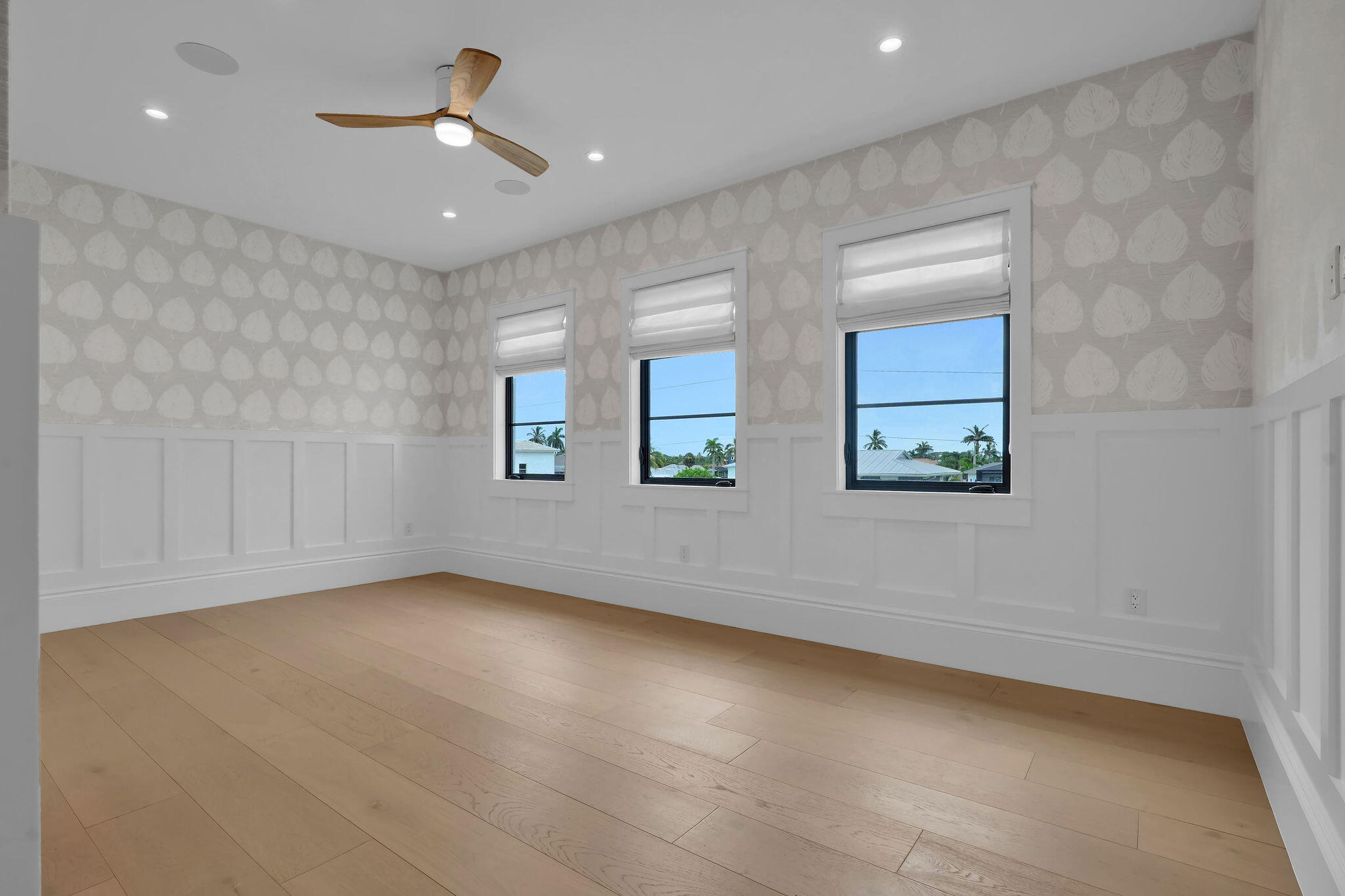 839 Chestnut Court Marco Island, FL 34145 - Photo 84 of 88 an empty room with windows and ceiling fan