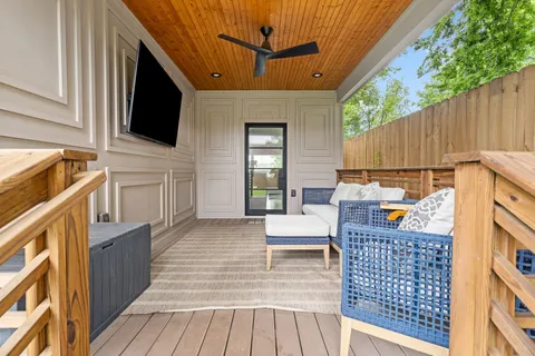 a view of a patio with wooden floor