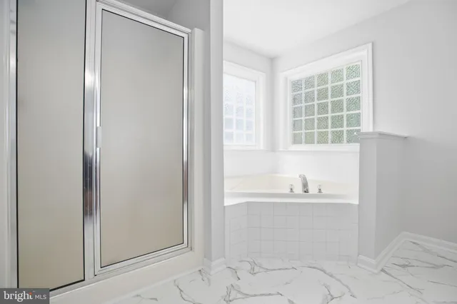 a bathroom with a bathtub and a sink