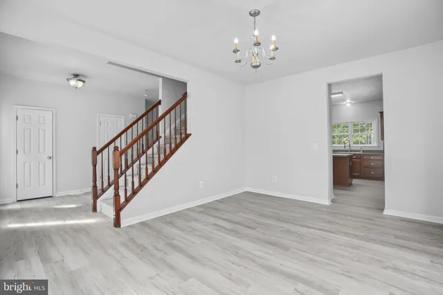 a view of an entryway with wooden floor