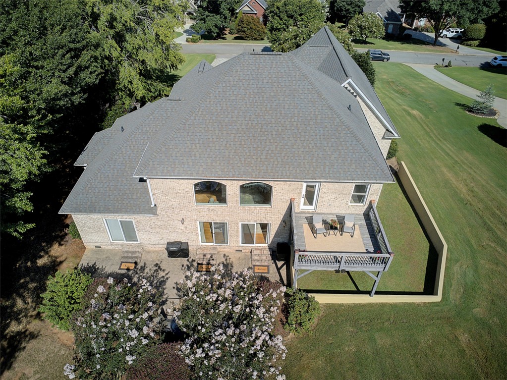 100 Turnberry Road Anderson, SC 29621 - Photo 39 of 41 An aerial perspective showcases a spacious brick residence with a large rear deck and ample green space.