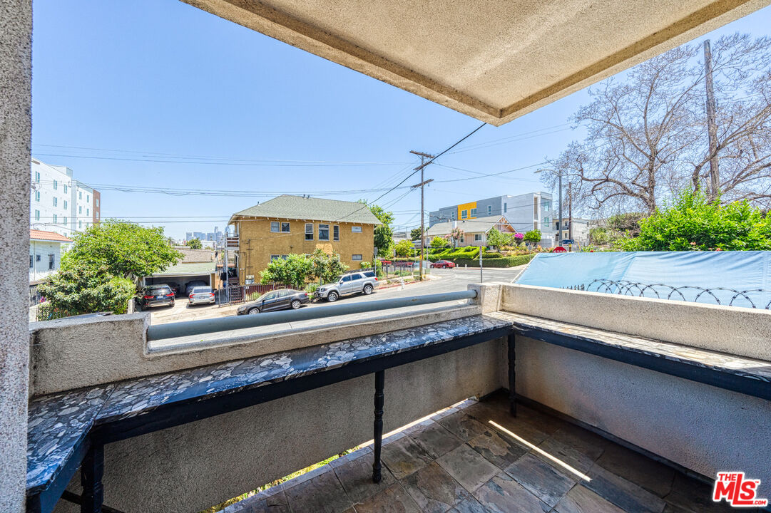 1043 South Kenmore Avenue, Unit 201 Los Angeles, CA 90006 - Photo 15 of 20 a view of a living room and window