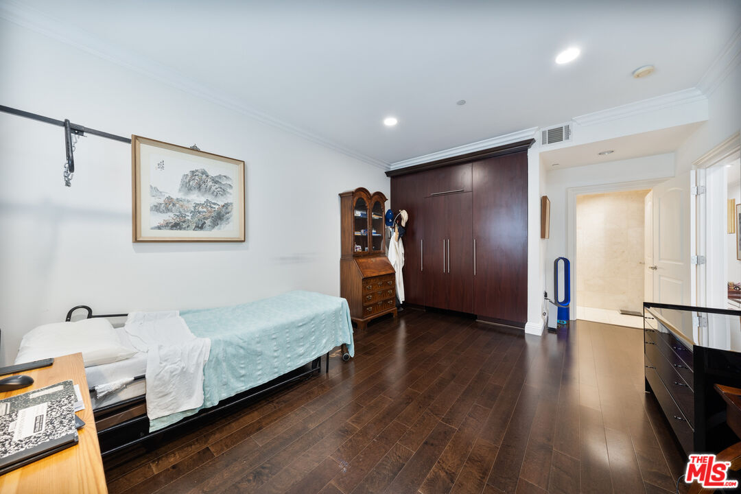 1043 South Kenmore Avenue, Unit 201 Los Angeles, CA 90006 - Photo 10 of 20 a view of a hallway with wooden floor