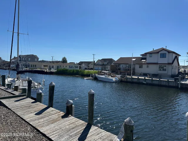 a view of a lake with boats and a bridge