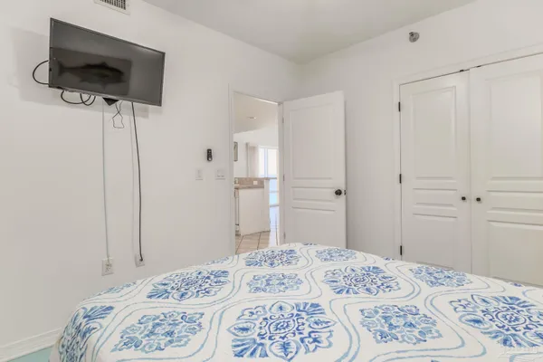 a bedroom with a bed and a view of bathroom