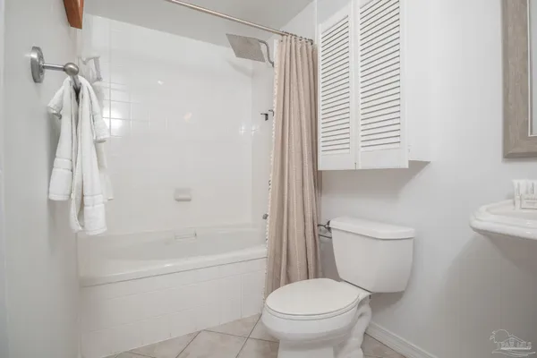 a bathroom with a toilet and a bathtub
