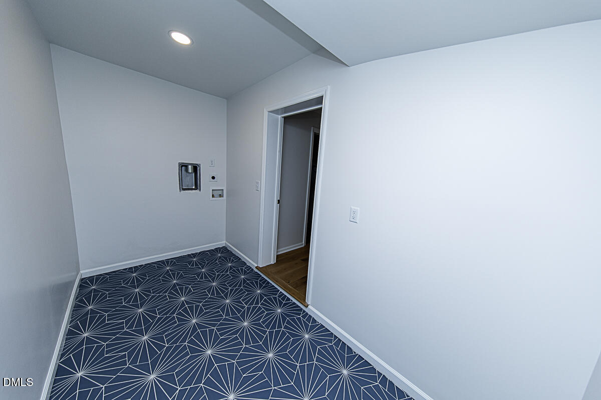 1208 Lorimer Road Raleigh, NC 27606 - Photo 17 of 37 a view of hallway with wooden floor