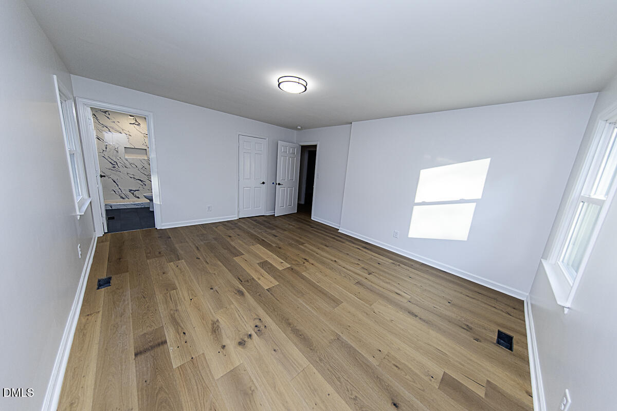 1208 Lorimer Road Raleigh, NC 27606 - Photo 20 of 37 a bed room with a bed