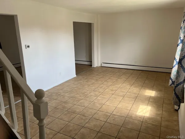 a view of an empty room with windows