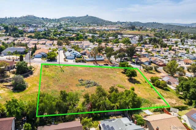 an aerial view of lake residential houses with outdoor space and trees