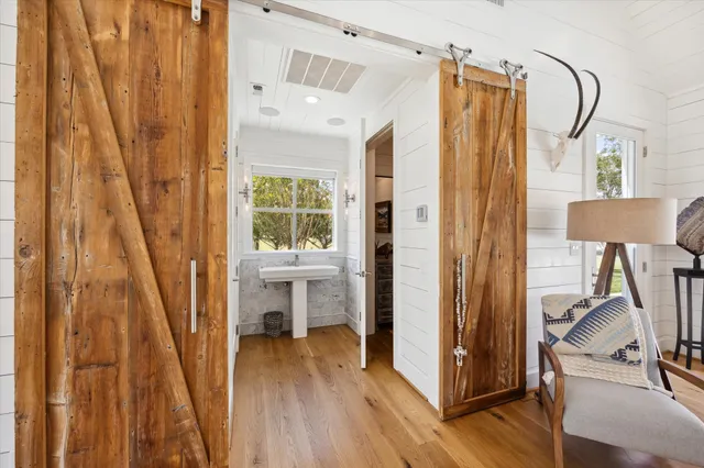 a view of a bathroom with a tub and windows