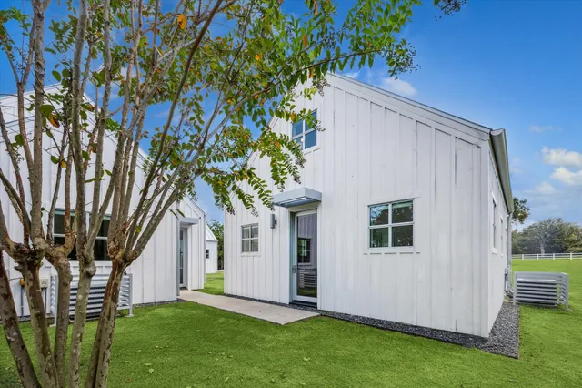 a view of house with backyard