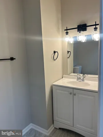 a bathroom with a sink and mirror