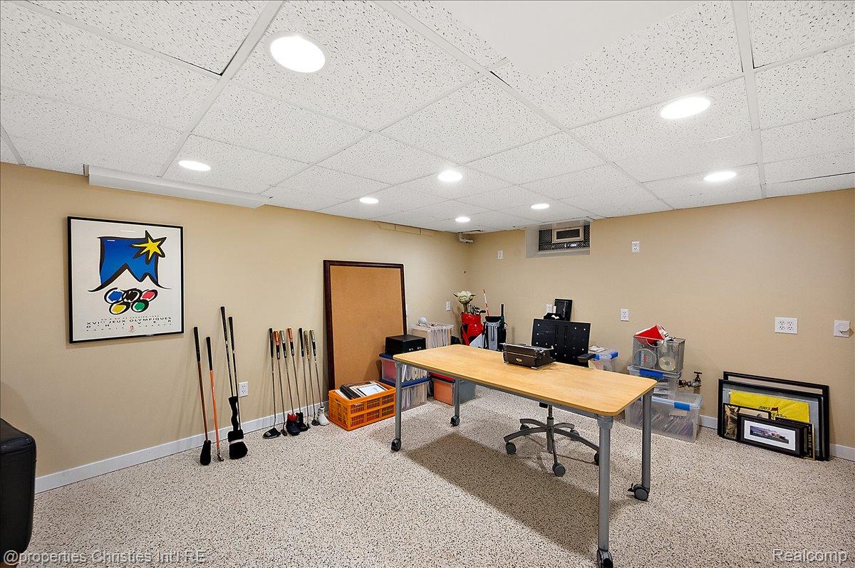 135 Clifton Road Bloomfield Hills, MI 48301 - Photo 61 of 77 Finished basement space featuring recessed lighting, a drop ceiling, light-toned walls, and speckled flooring