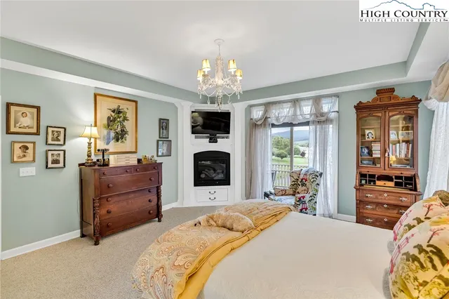 a bed room with furniture and a fireplace