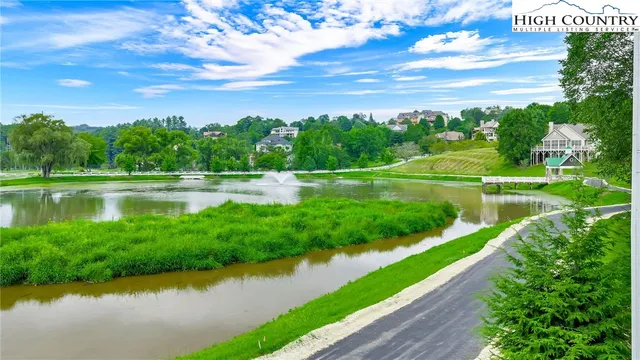 a view of a lake with a big yard