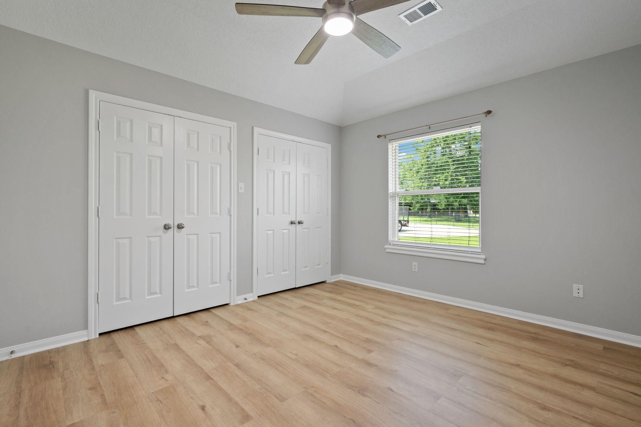 460 West Houston Street Highlands, TX 77562 - Photo 11 of 14 a view of an empty room with wooden floor and a window